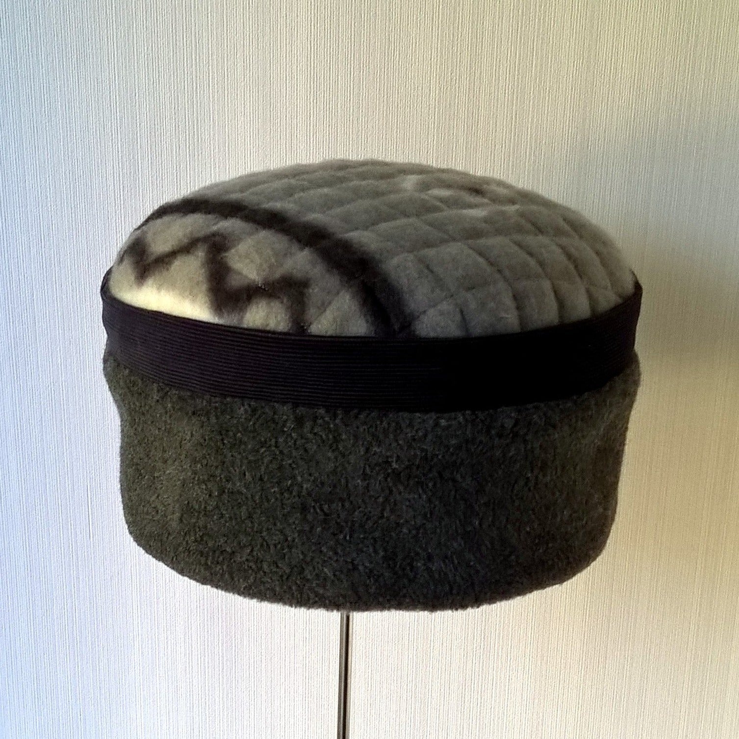 Grey fleece hat  with navy corduroy trim and tribal patterned tip