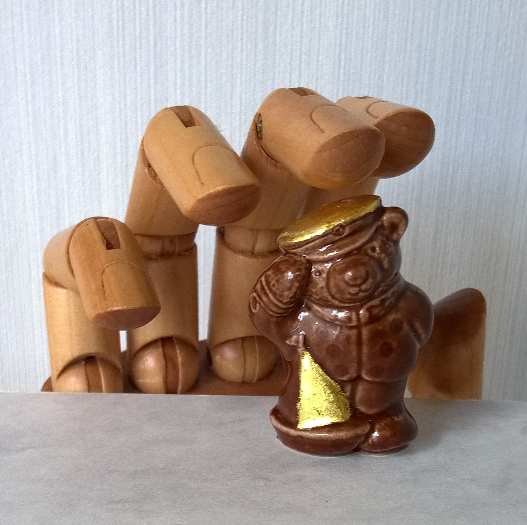 Little brown ceramic sailor bear with toy boat gilded with pure gold leaf