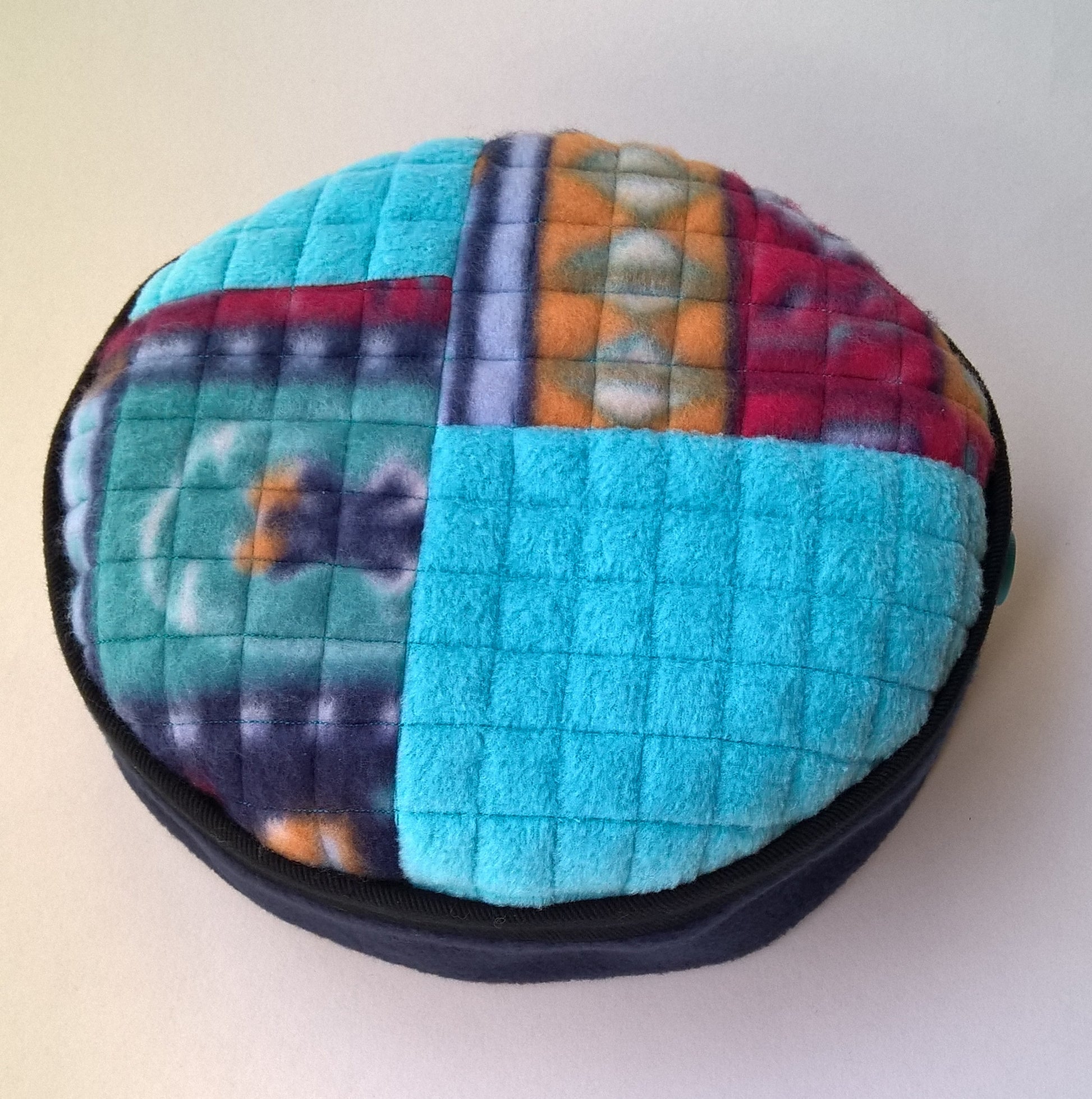 Multi coloured patchwork tip of brimless fleece unisex cap