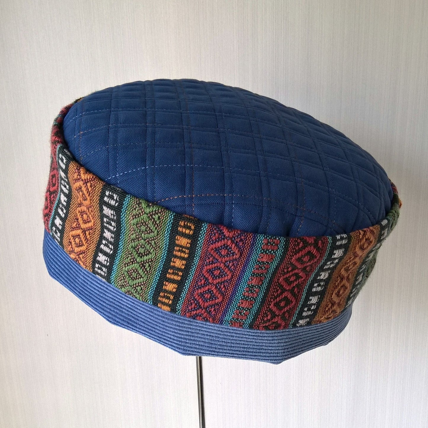 Ethnic brimless hat in multi coloured stripes