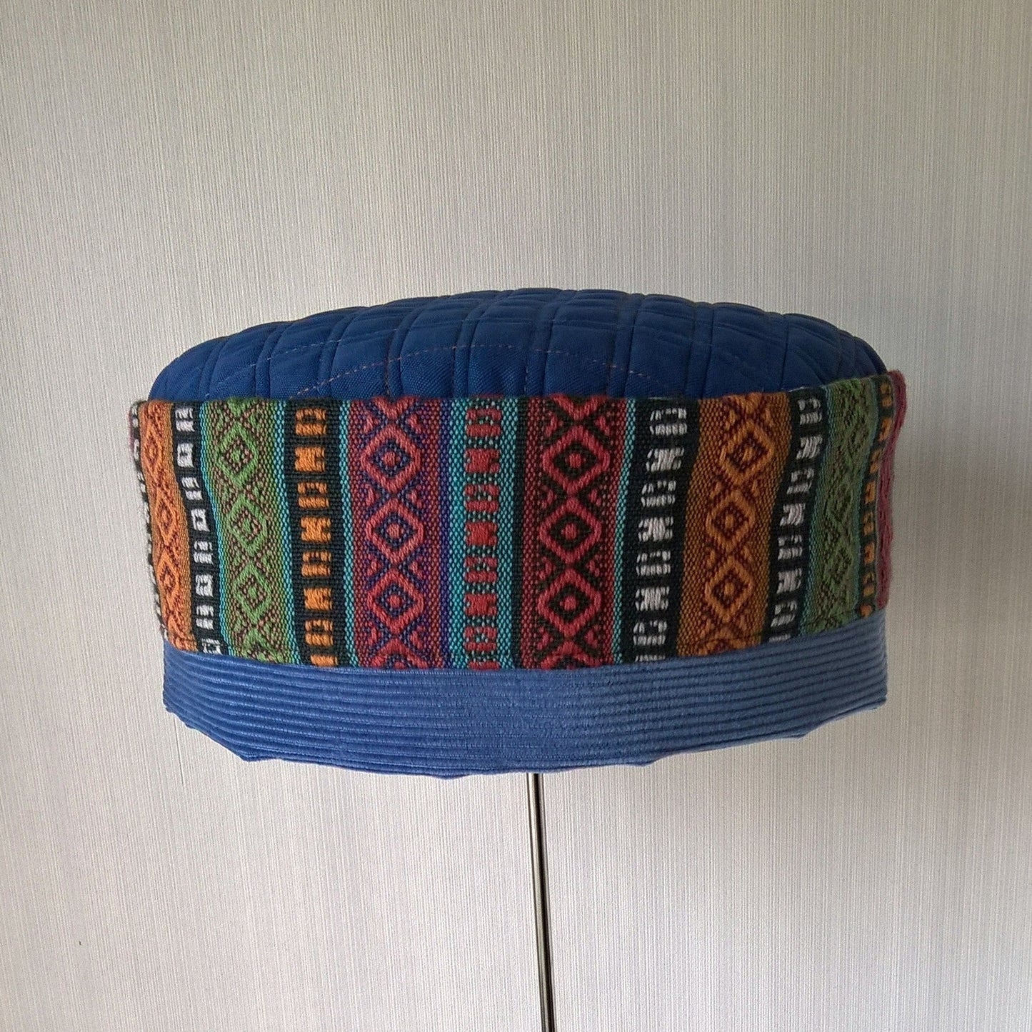 Blue brimless hat with bright multi coloured ethnic crown