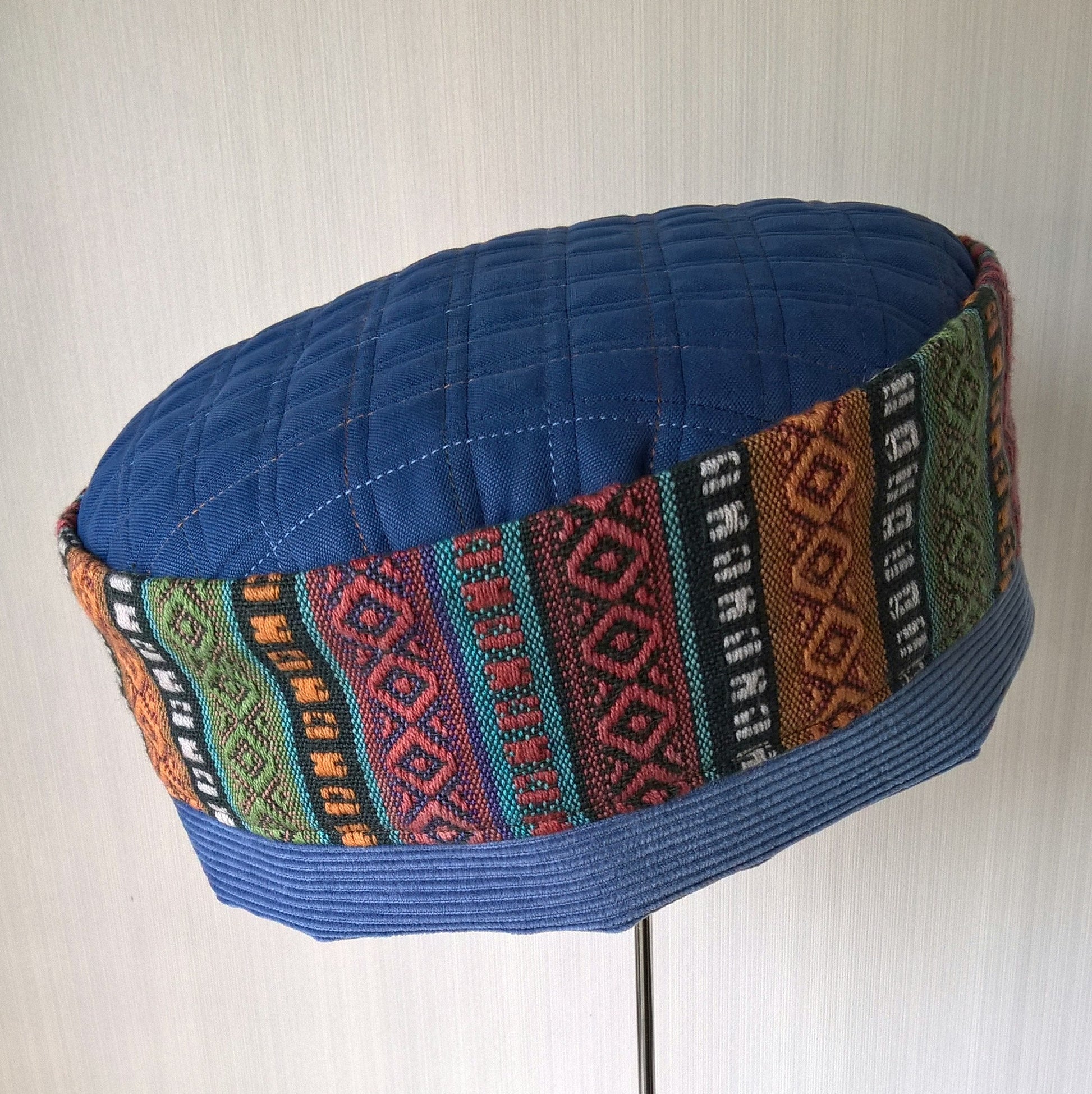 Brimless hat in colourful ethnic stripes and soft corduroy