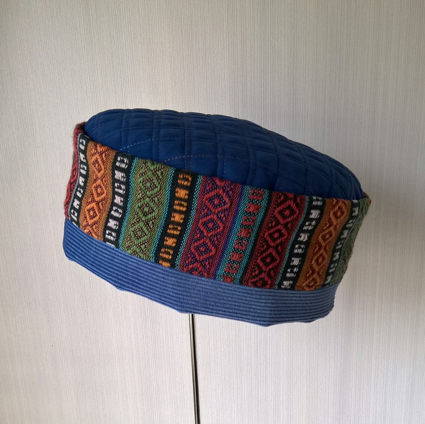 Pillbox shaped ethnic striped hat