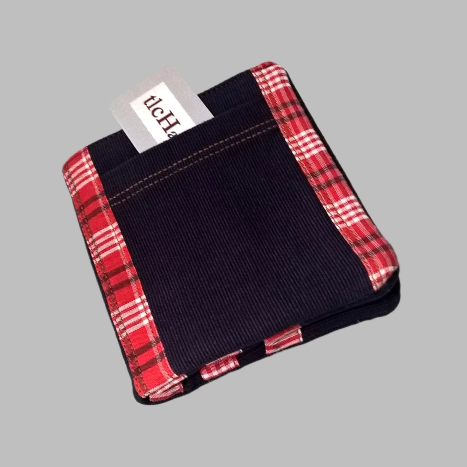 Navy corduroy billfold wallet with red check trim and front ticket pocket feature