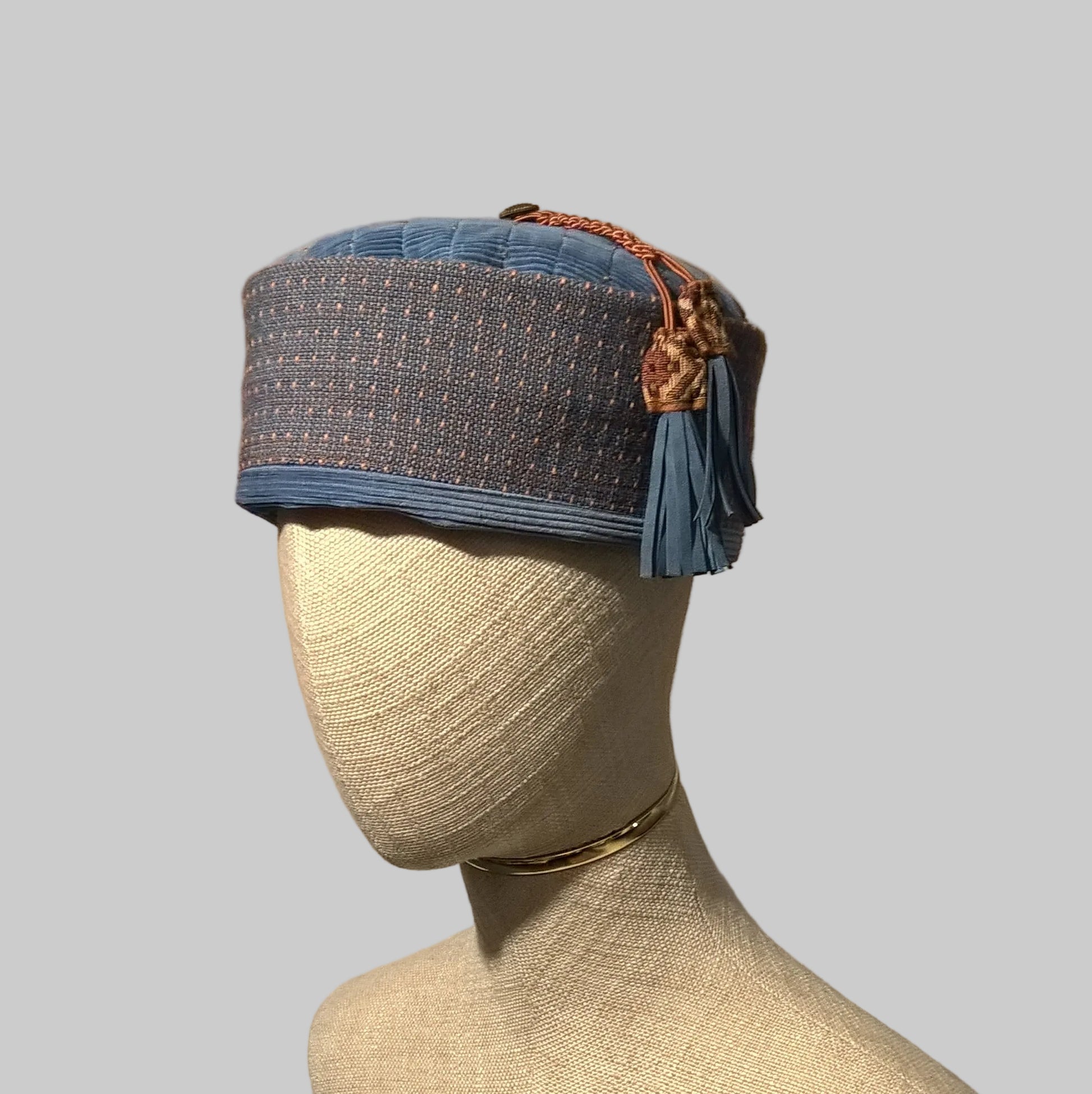 Pale blue corduroy smoking cap with beaded tip and macrame tassel with leather fringing