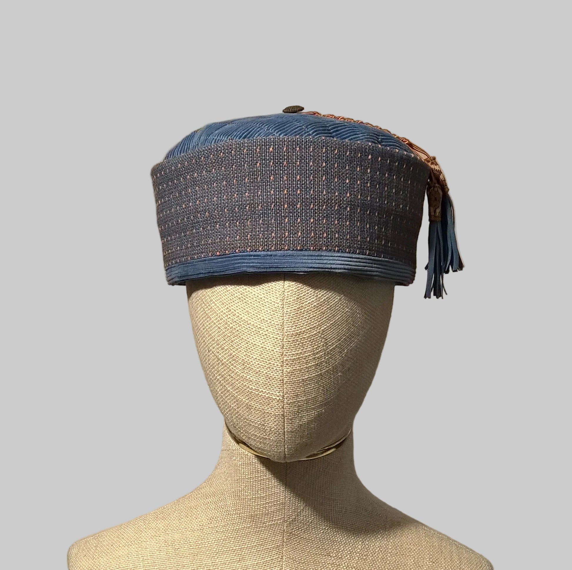 Pale blue corduroy smoking cap with beaded tip and removable macrame tassel with leather fringing