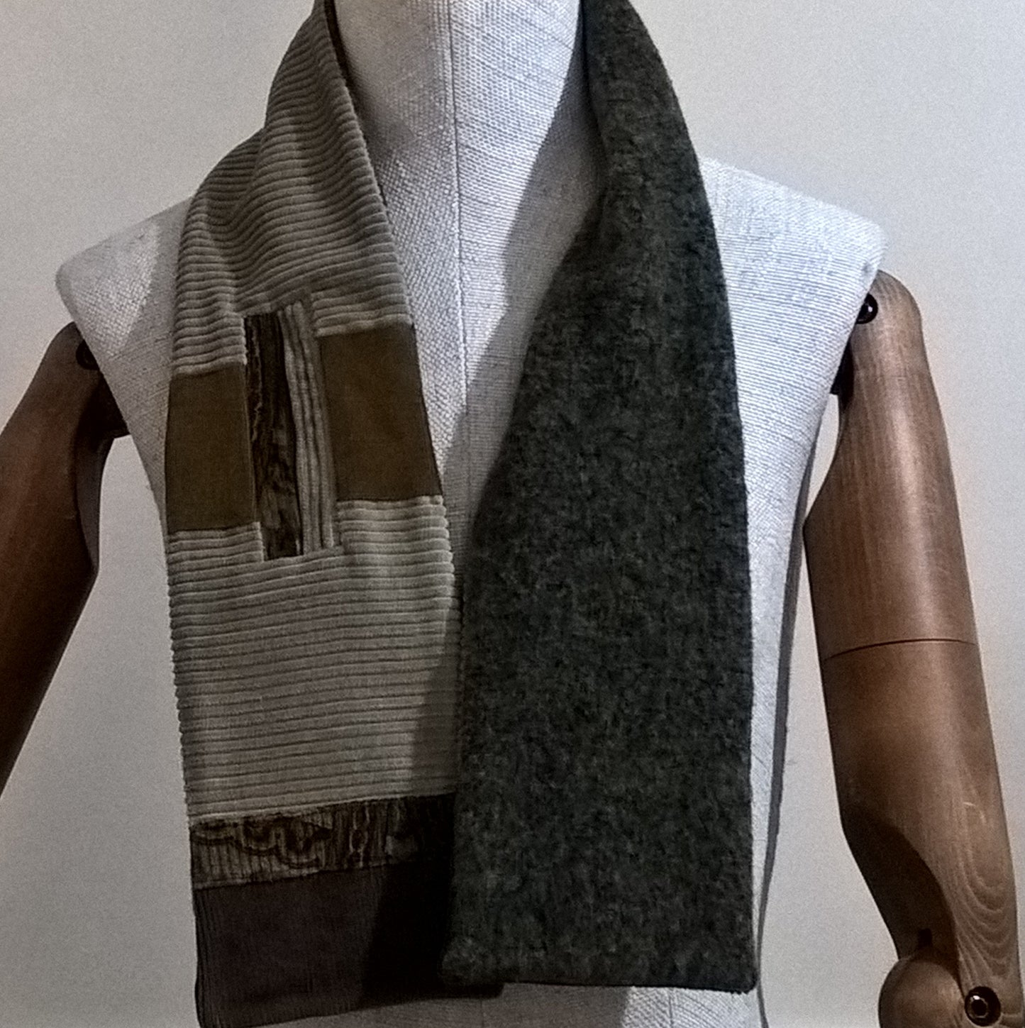 The patchwork keyhole scarf has a brown marl  fleece lining