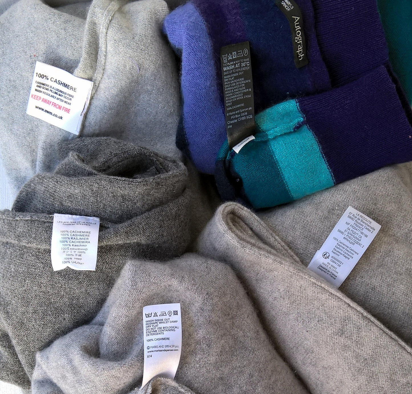 A variety of preloved cashmere sweaters for up-cycling