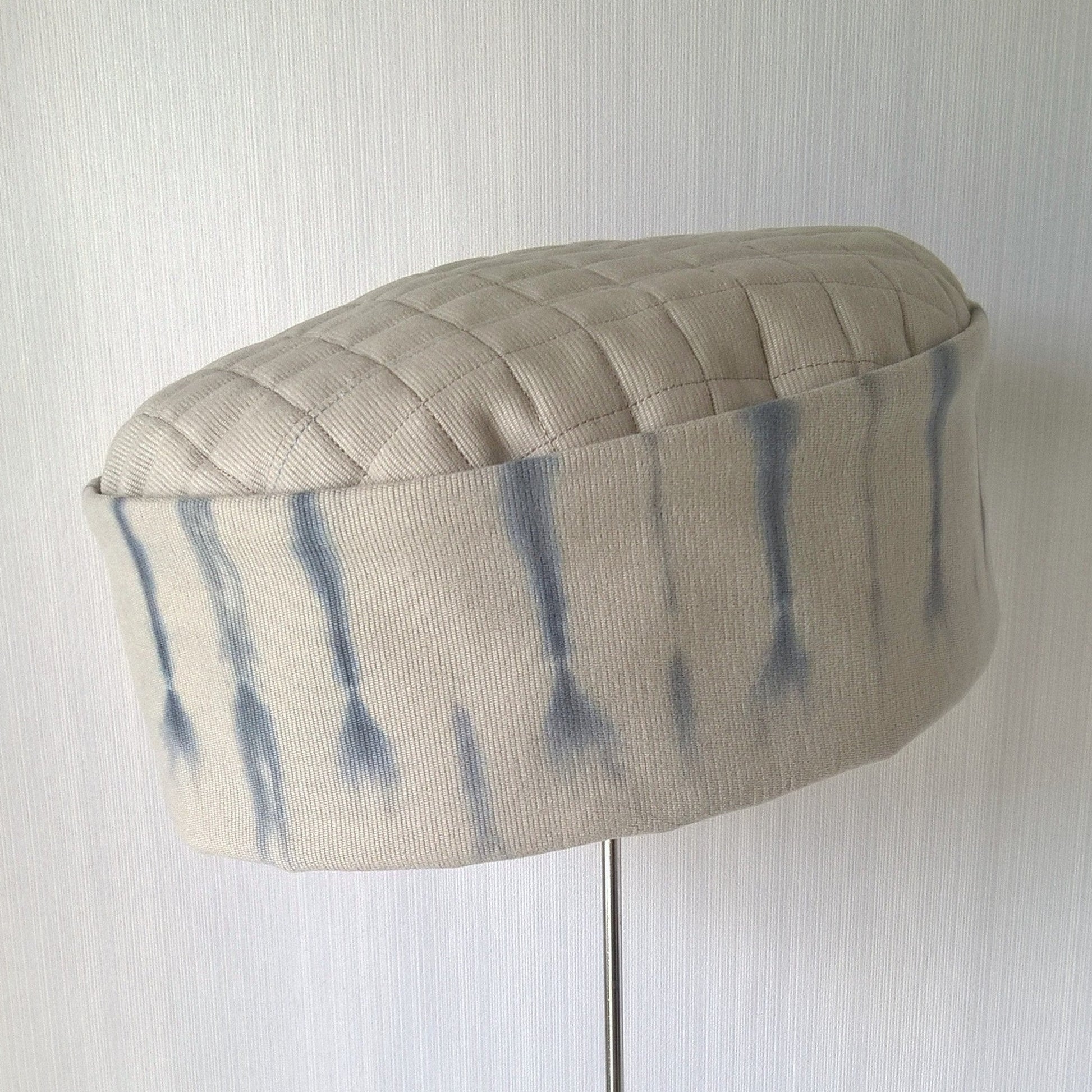 Pillbox shaped hat with tie dyed crown and quilted tip