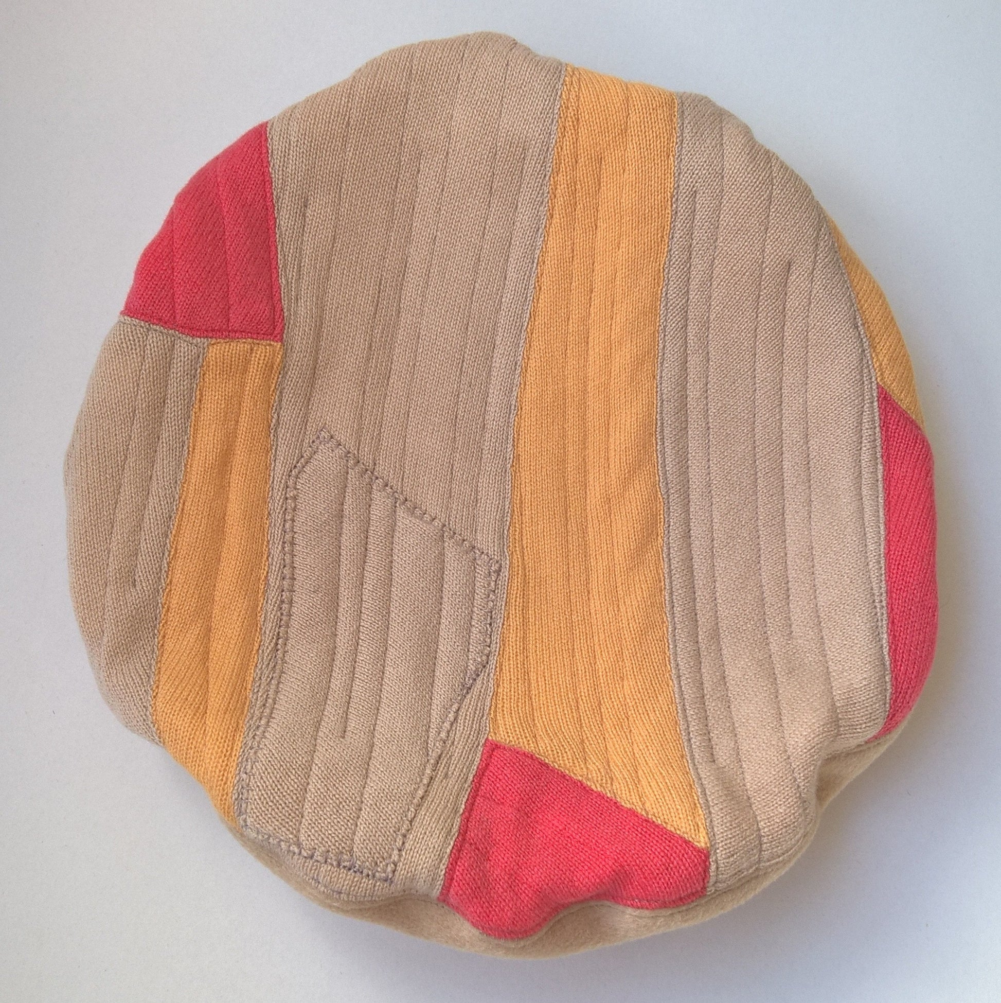 Tip of beret showing patchwork design and quilting