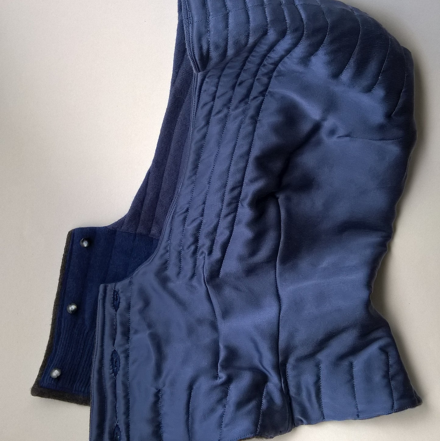 Hood is fully lined with blue silk which is part quilted to the cashmere