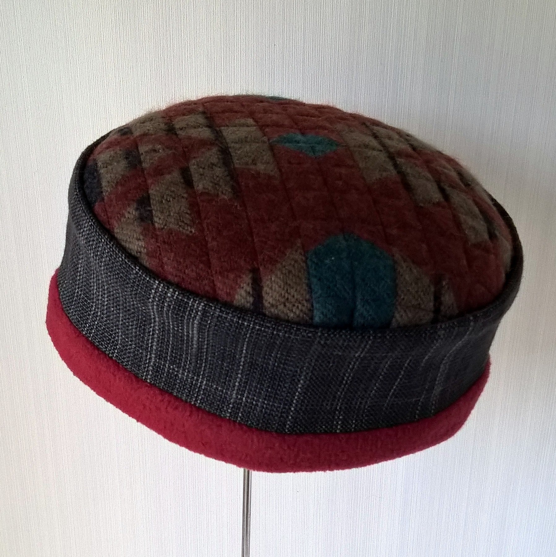 Fleece lined brimless cap withe Aztec patterned tip