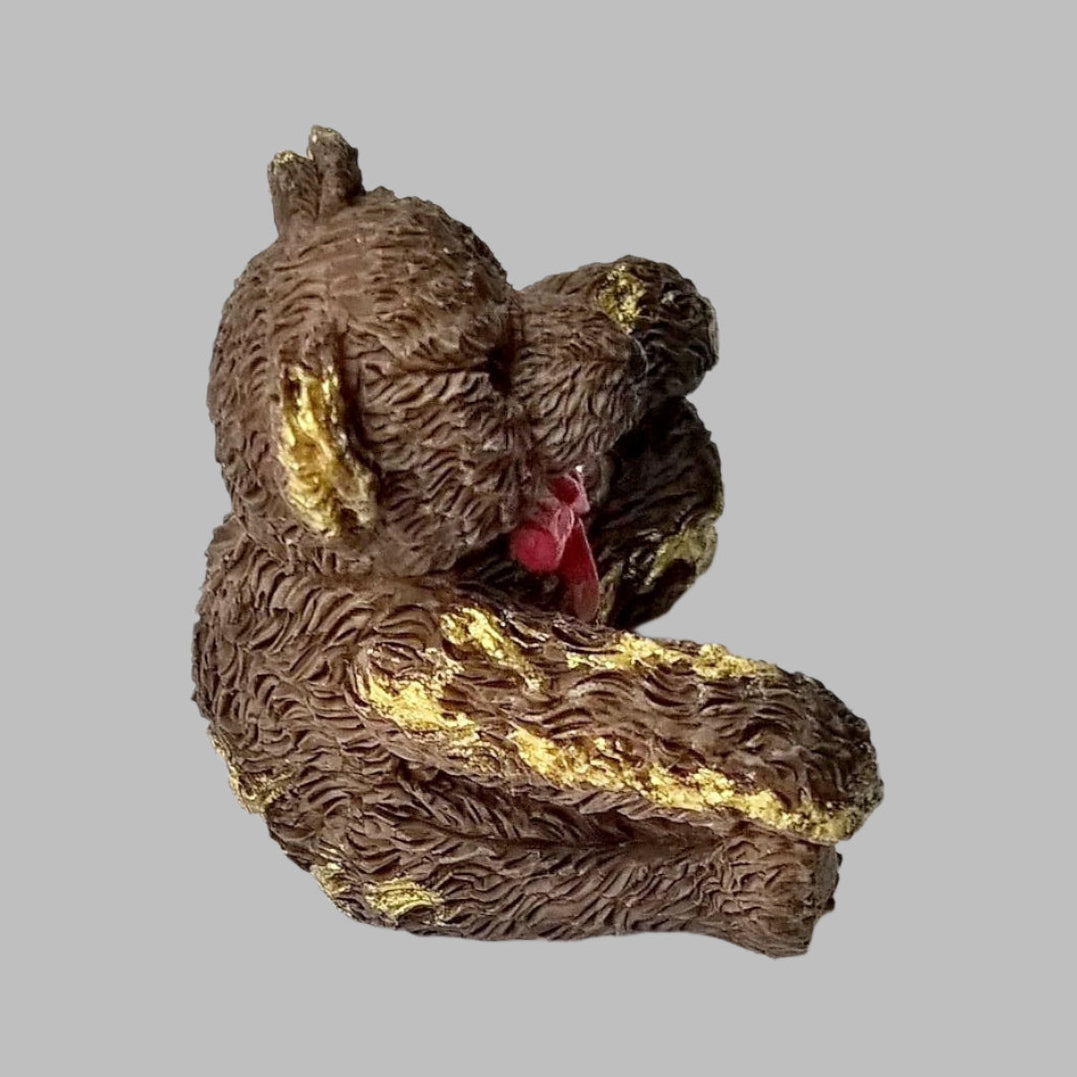 Vintage miniature ceramic brown bear from 1995 with bright red bow and hand gilded with pure 24ct gold to make it a unique one-off.  