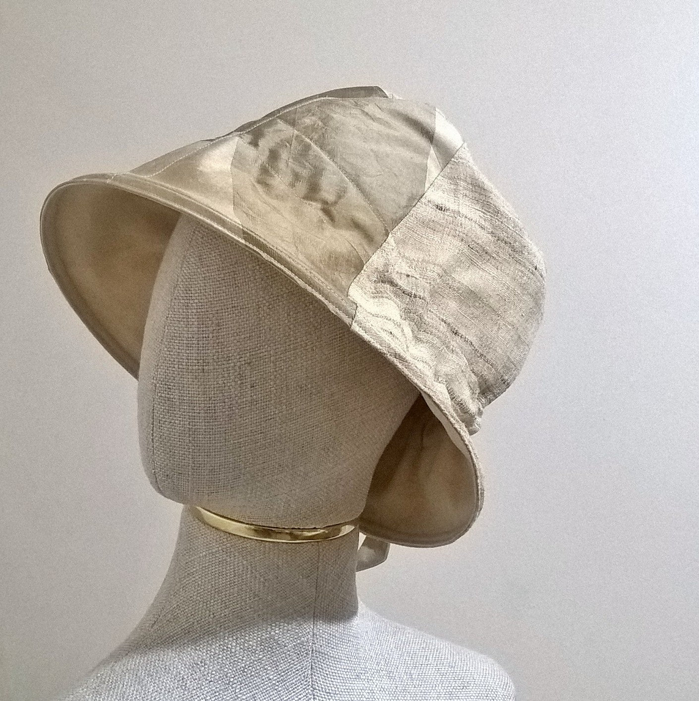 Silk bucket hat in neutral tones of beige taupe and gold