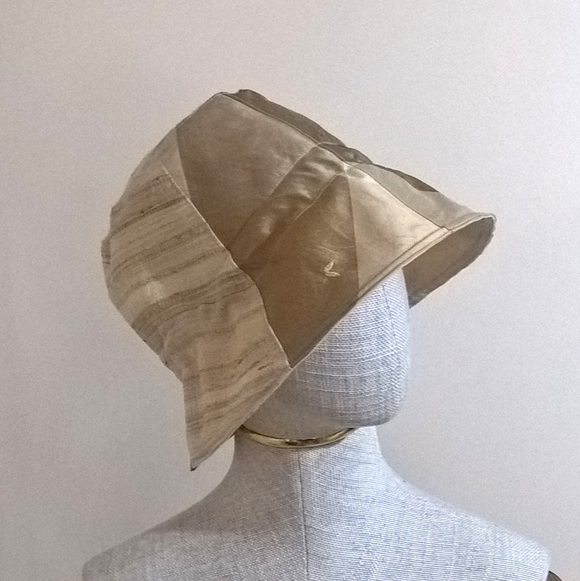 Side view of bell shaped silk bucket hat