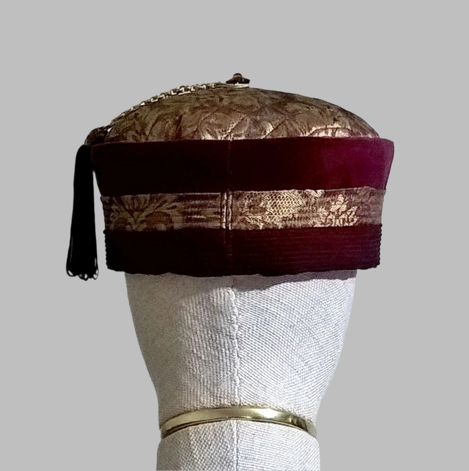 Back view of gold brocade and red velvet tassel smoking cap