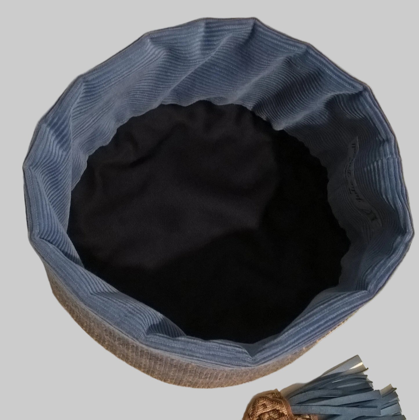 The smoking cap has a navy cotton lining