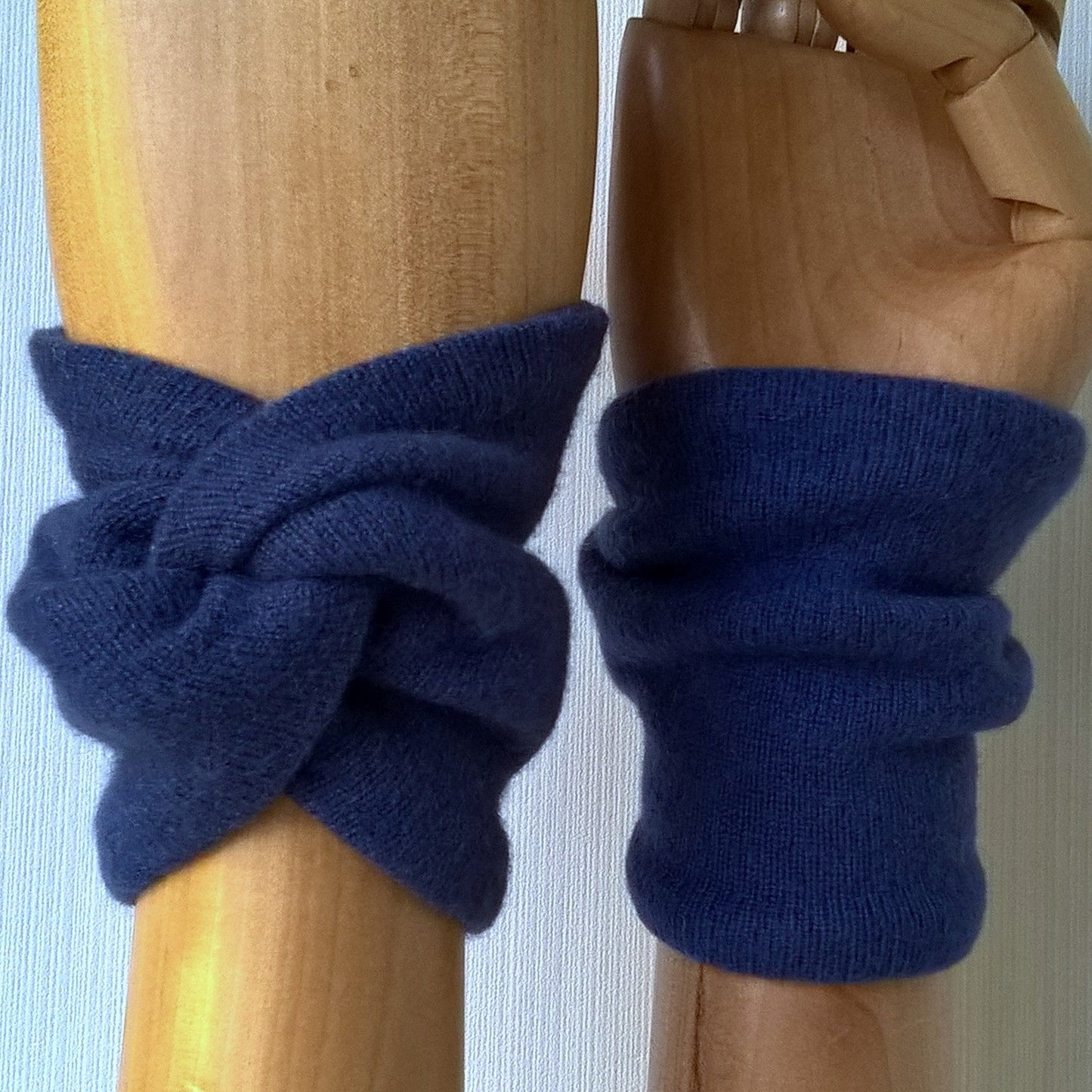 Spruce blue cashmere wrist warmers in a knot design