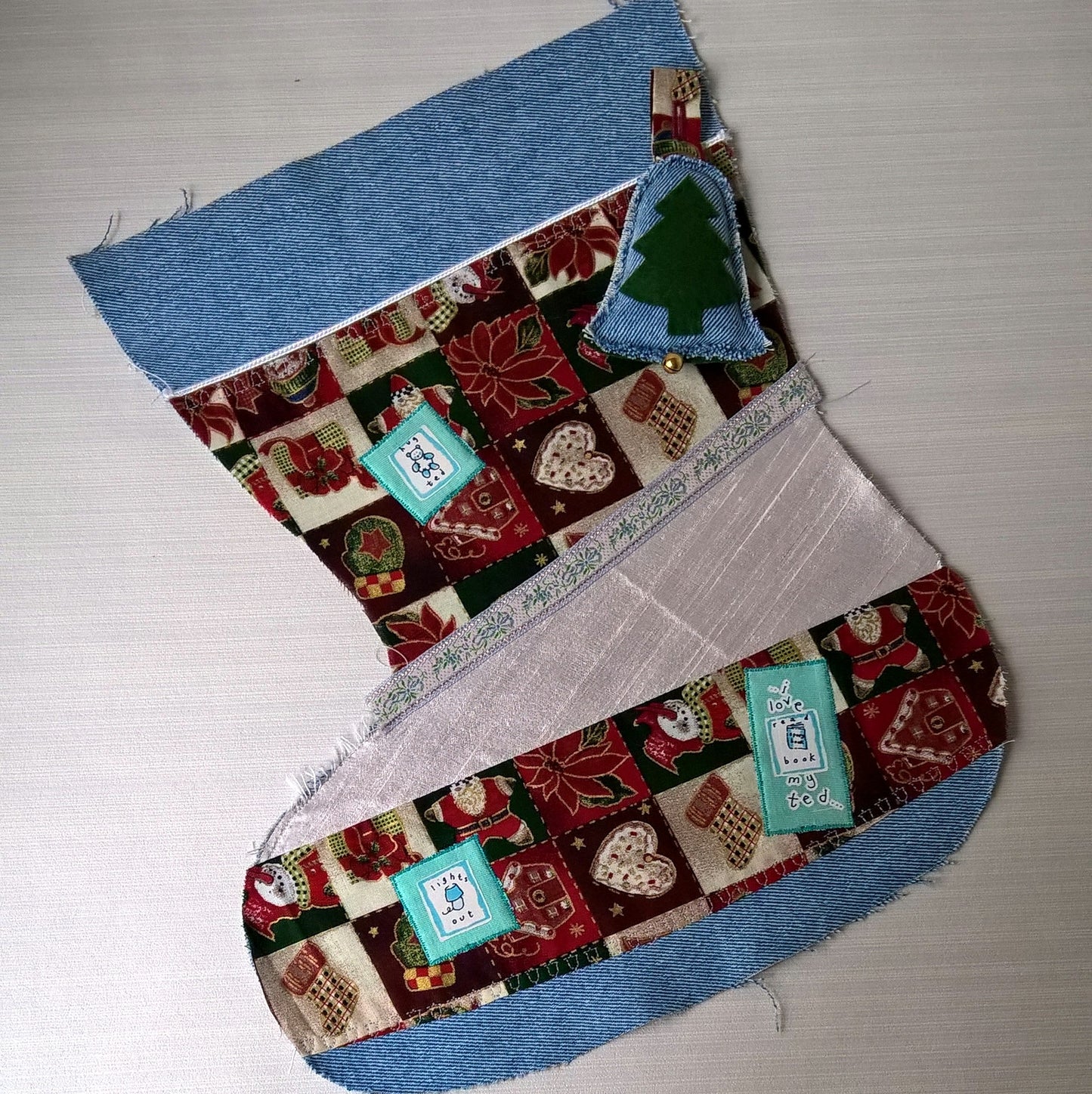 Stonewash Christmas stocking given a traditional feel with patch work and applique