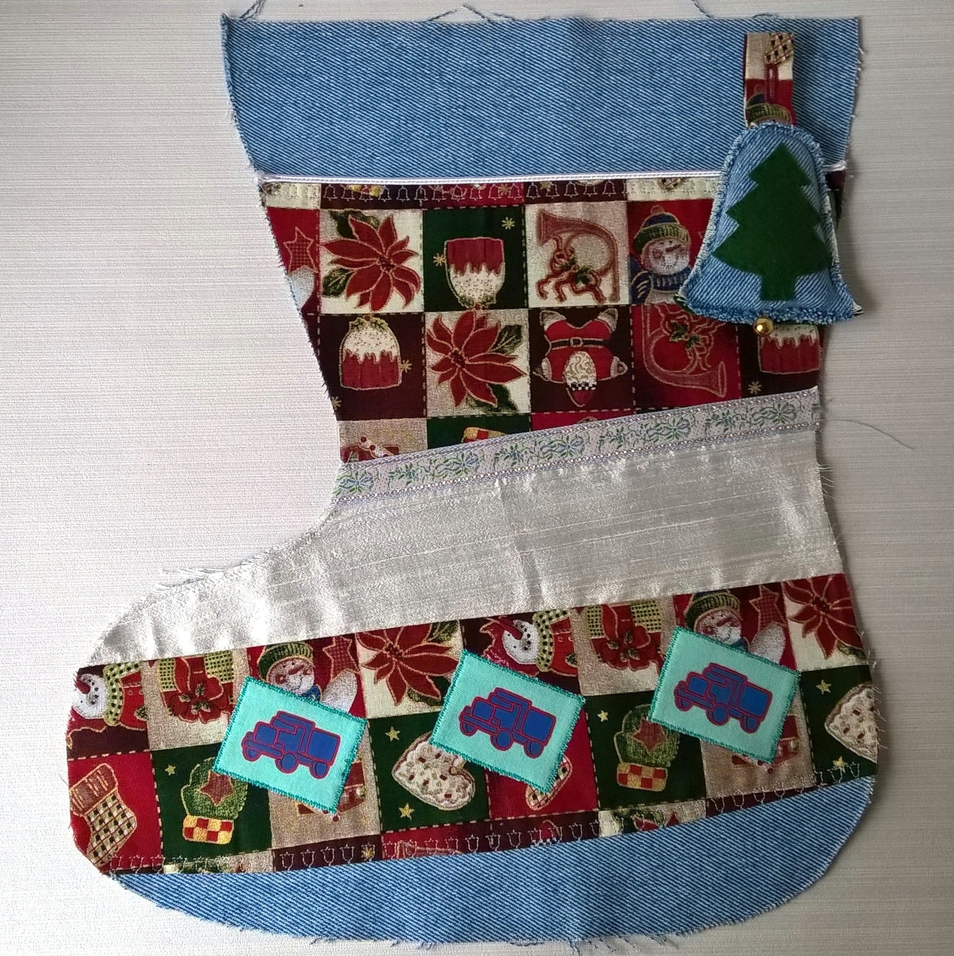 Stonewash Christmas stocking with trucks motifs ready for name embroidery