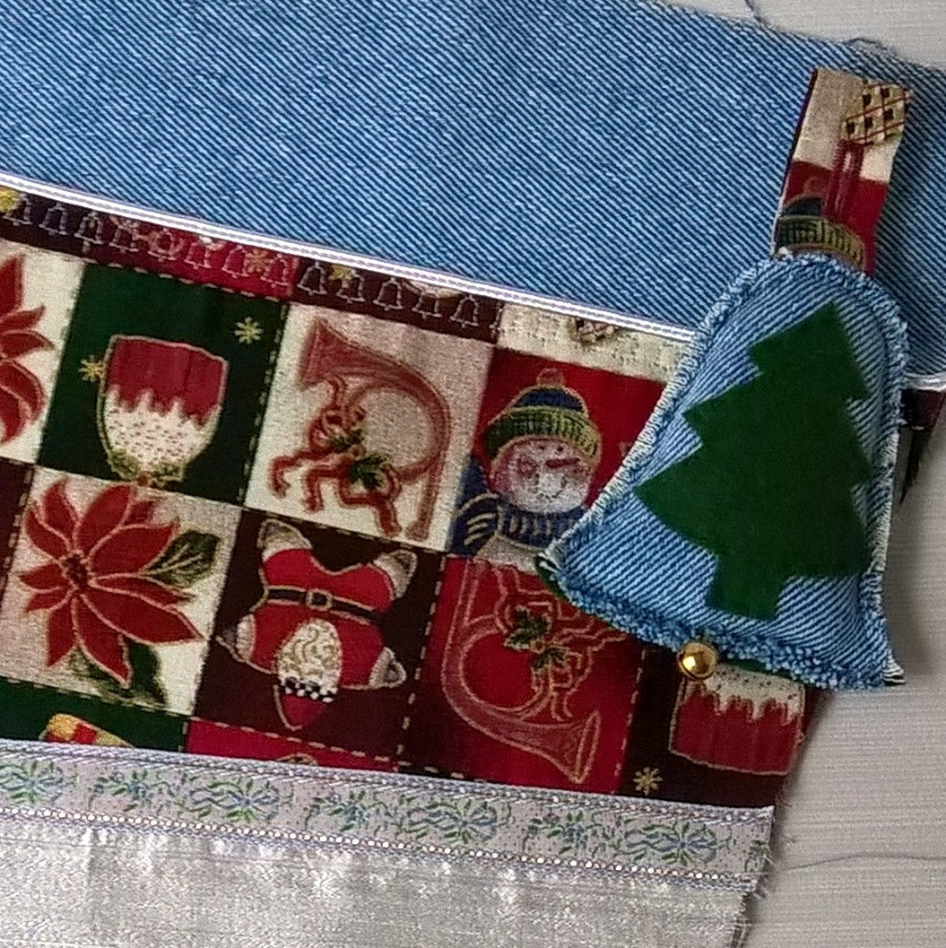 Stonewash denim  stockings are patch worked with Christmas fabric and have a bell that jingles