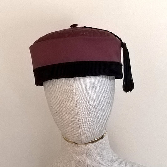 Maroon and black smoking cap with quilted and beaded tip and macrame tassel