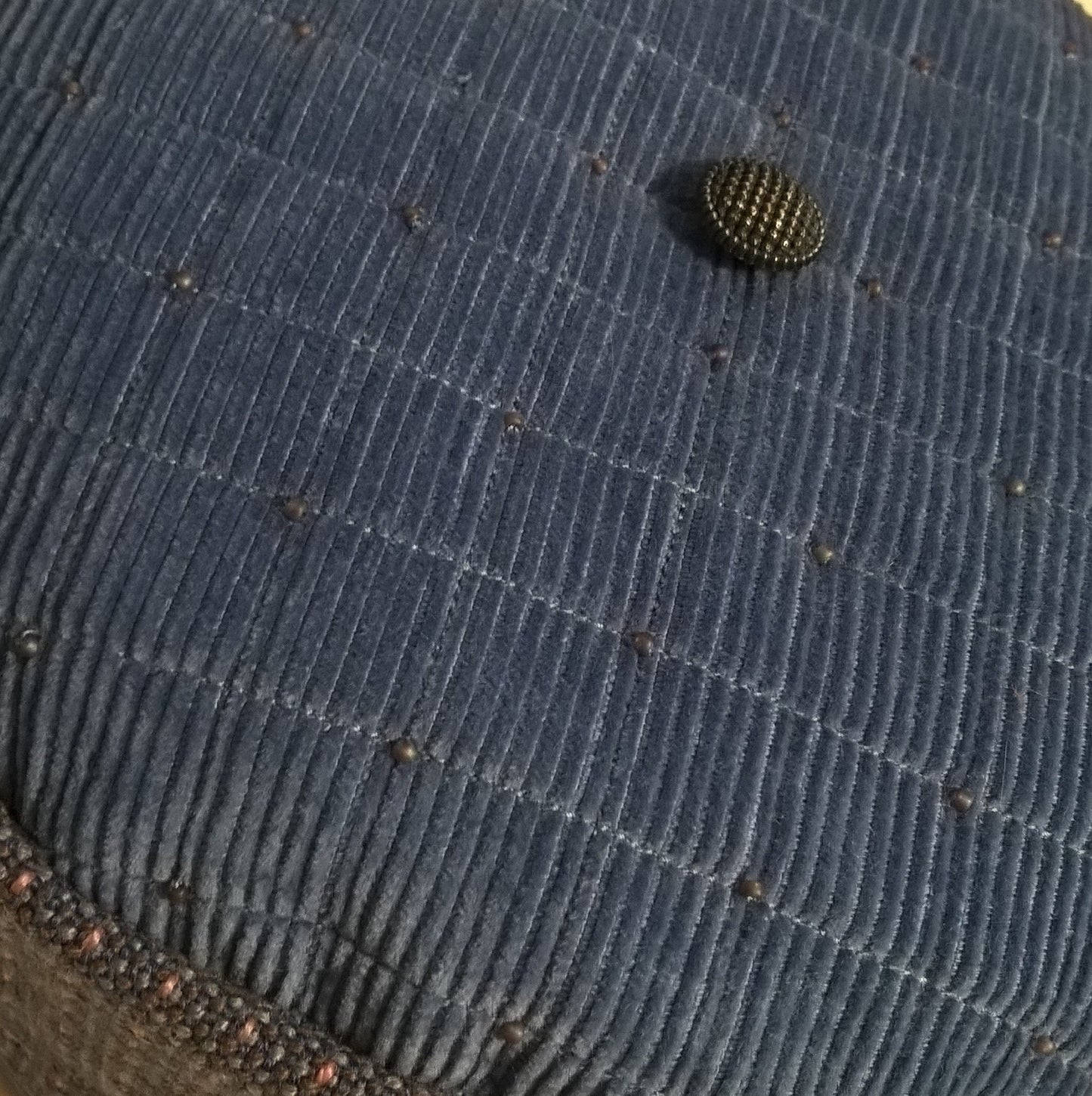 Tip of smoking cap is quilted with merino wool, beaded and finished with a vintage button