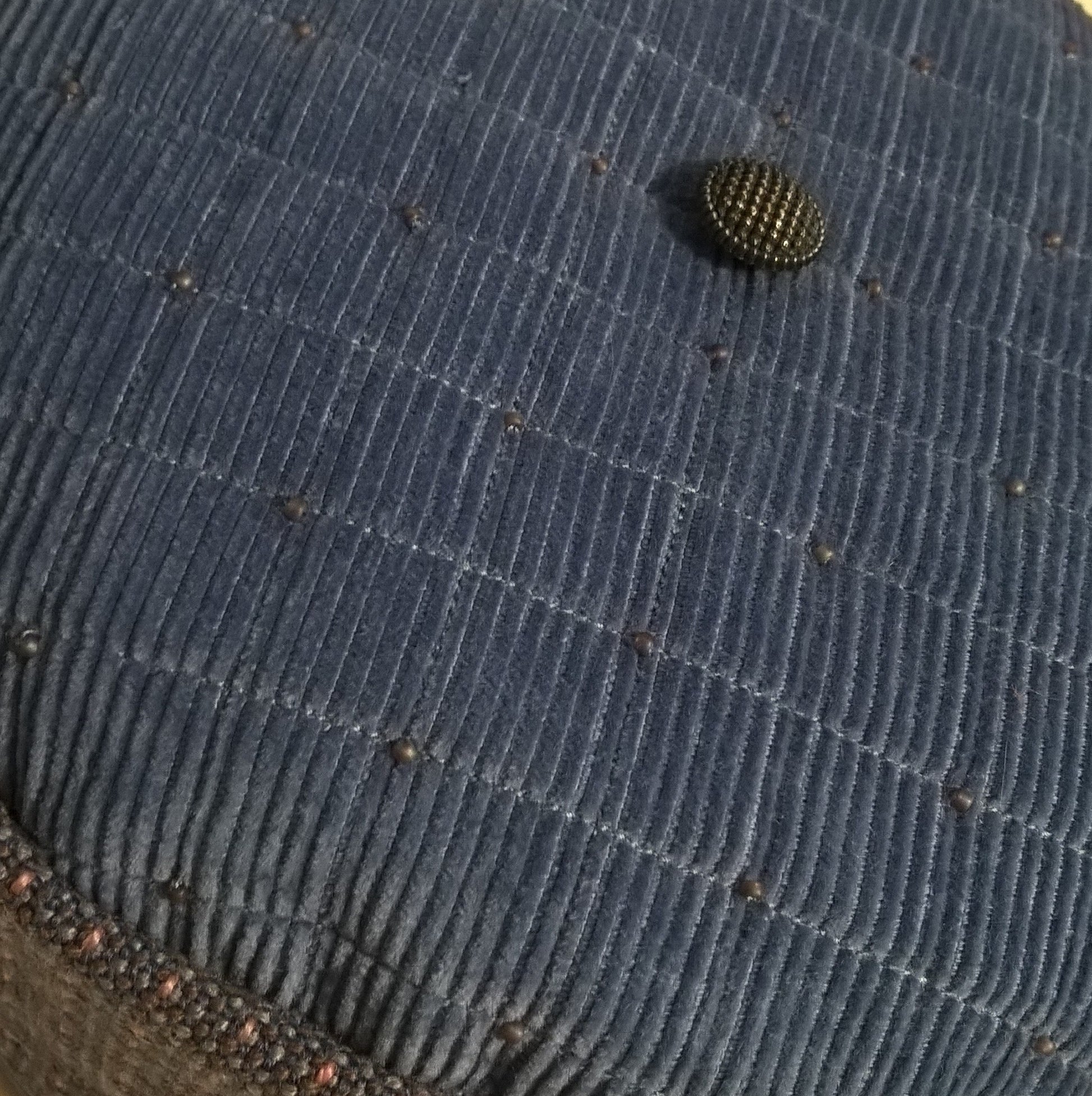 Tip of smoking cap is quilted with merino wool, beaded and finished with a vintage button