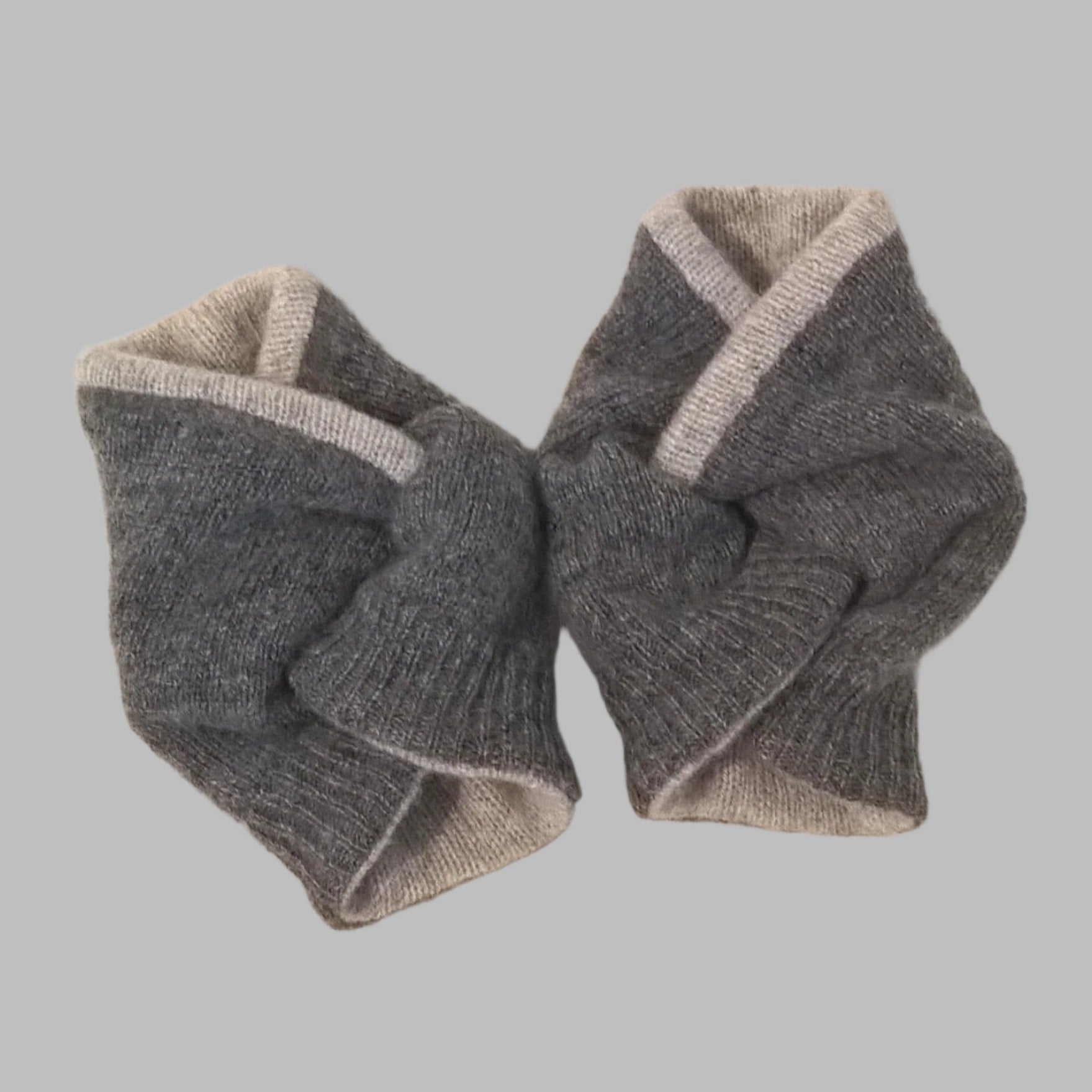 The rib detail on the two tone grey pure cashmere wrist warmer cuffs, handmade from up-cycled sweaters