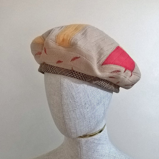 Patchwork Beret handmade from upcycled cashmere in fawn, red and yellow with leaf embroidery and contrasting check wool band