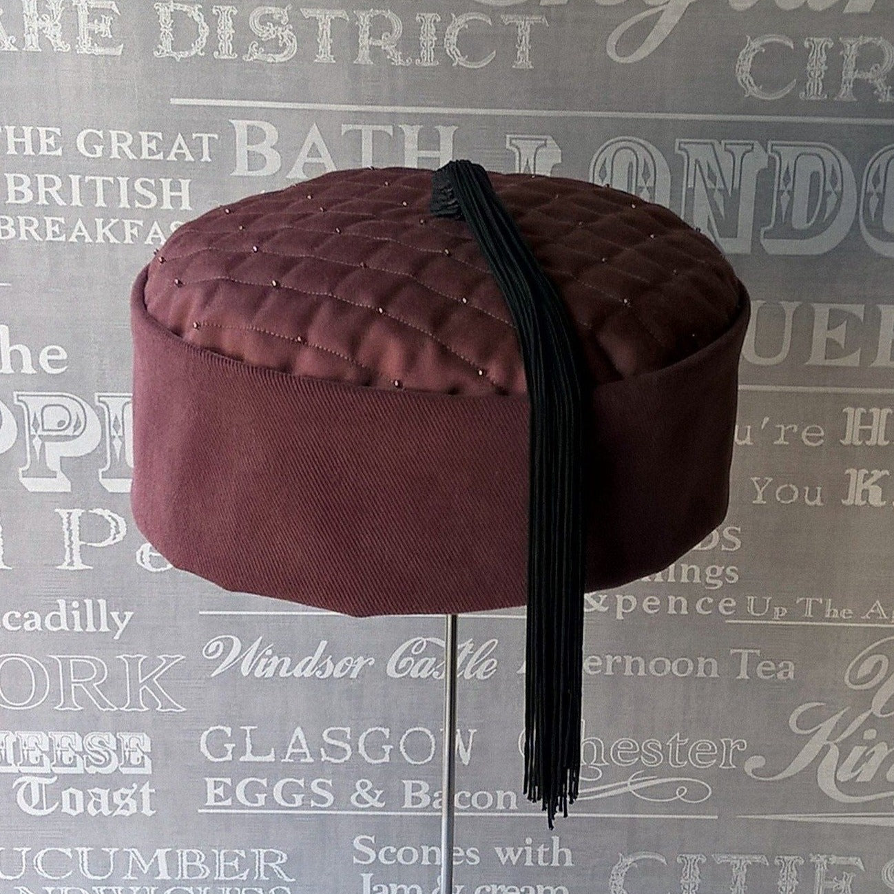 Quilted pillbox smoking cap in maroon with black tassel by TwiLd Capit Hog