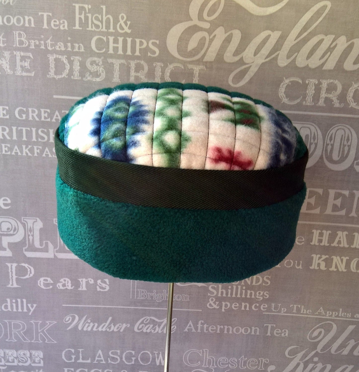 Forest green fleece hat with Aztec patterned tip