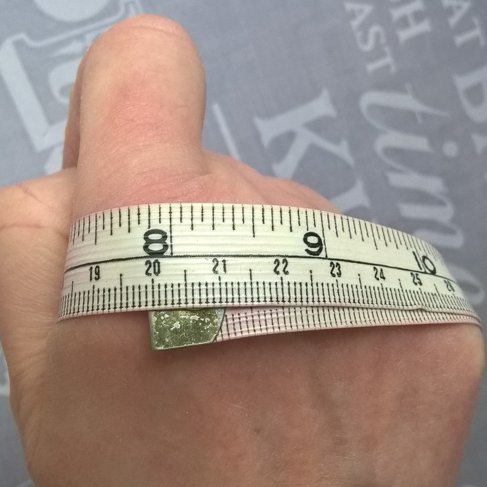 Measure around knuckles to determine size