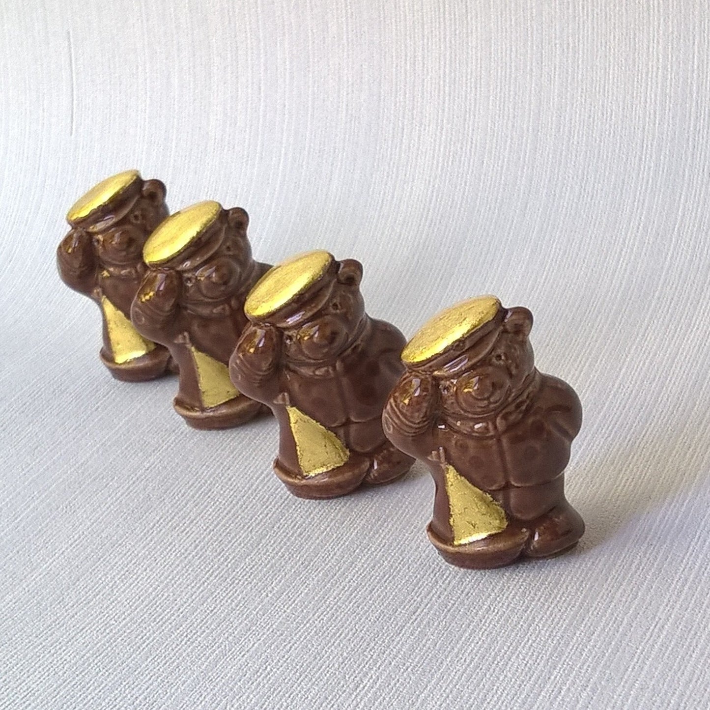 Vintage ceramic bears refreshed with pure gold leaf gilding 