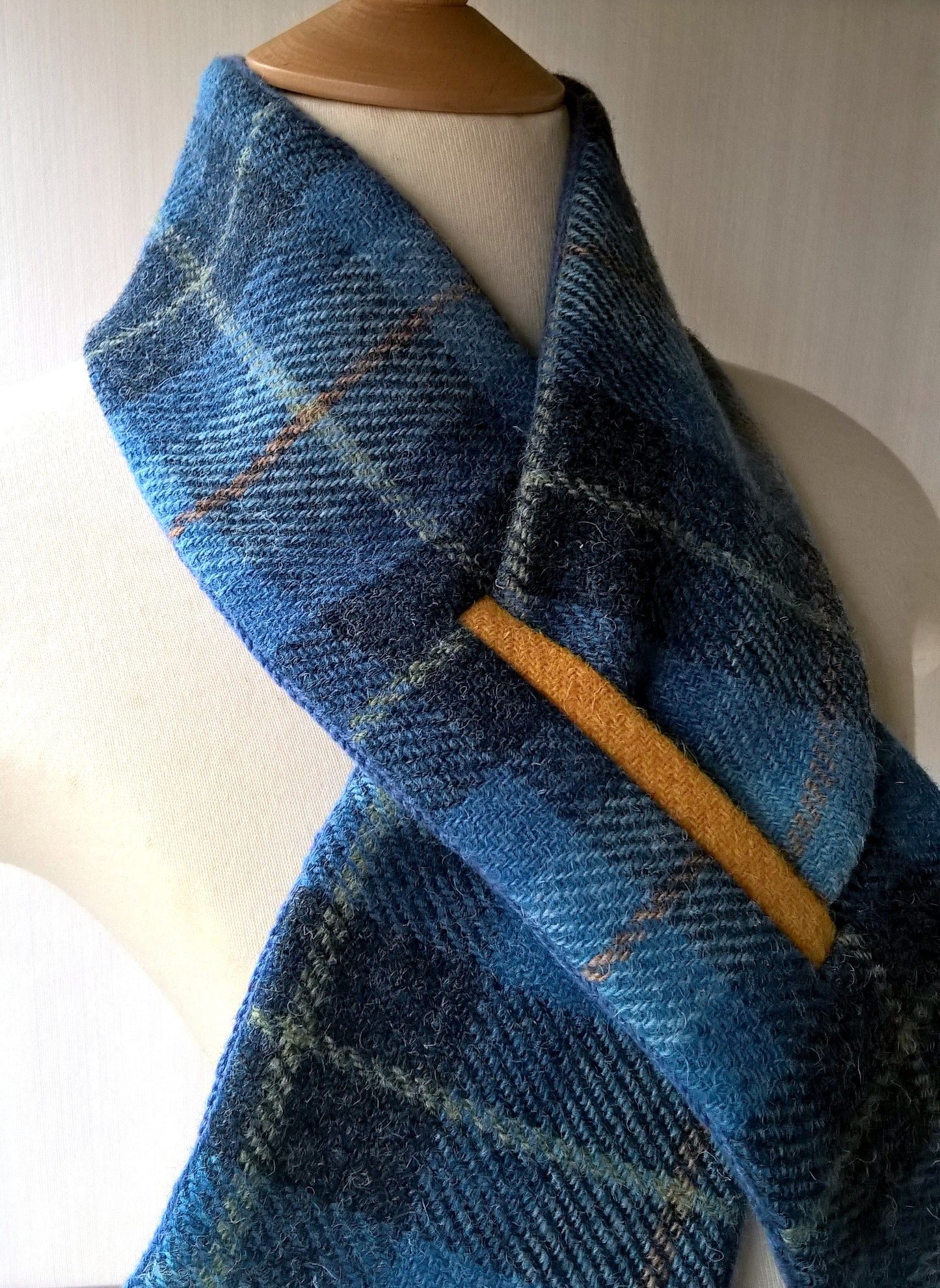 Blue Harris Tweed wool scarf with yellow trimmed keyhole closure