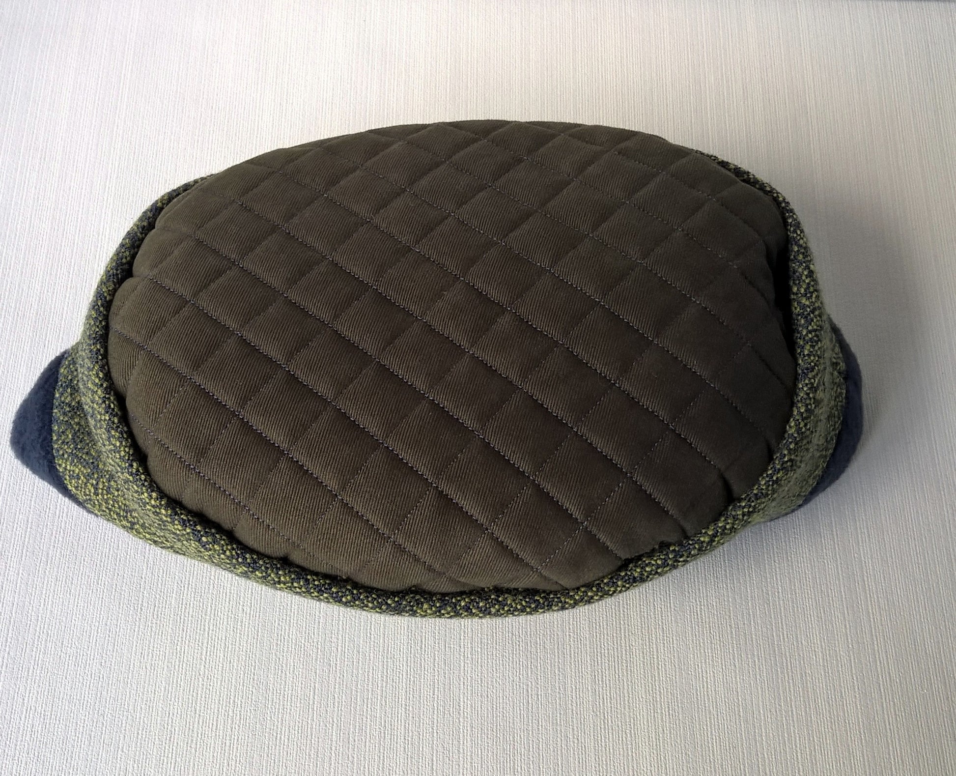 Pillbox hat with quilted tip