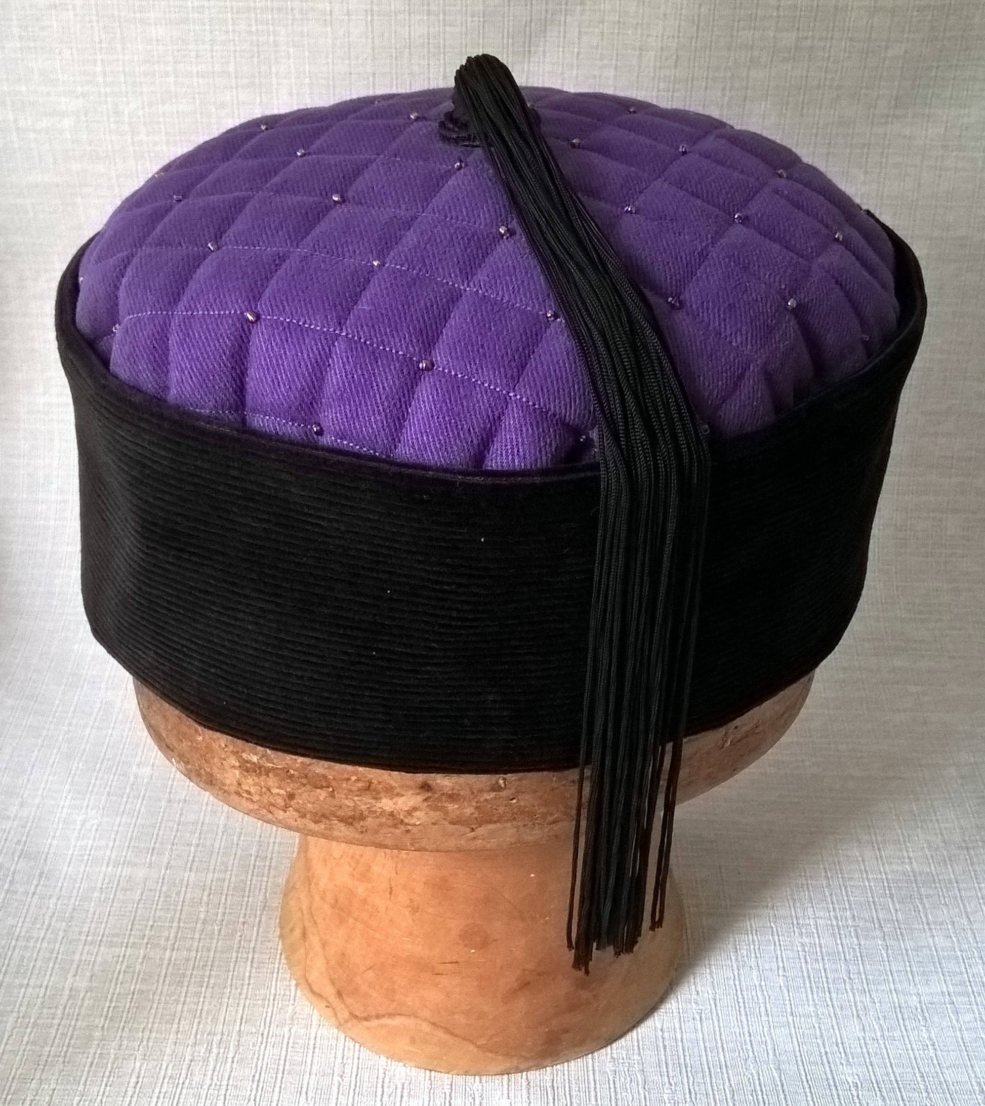 A beautiful tassel crafted from vintage black fringing completes this mens smoking cap