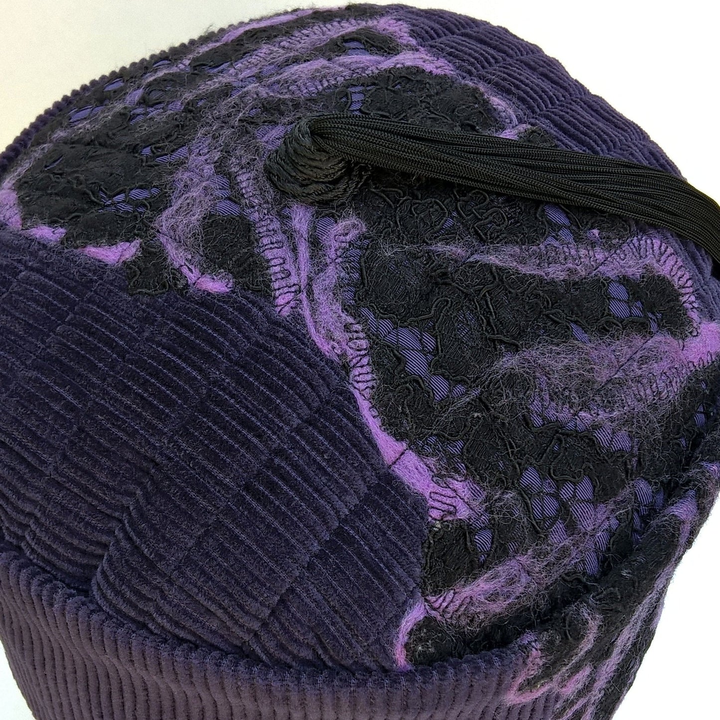 nuno felting and tassel detail on tip of purple corduroy smoking cap