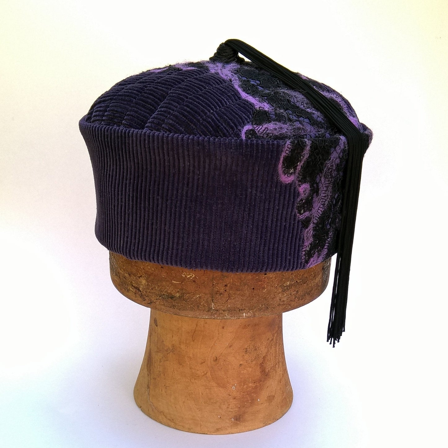 Front of purple smoking cap with nuno felting and tassel