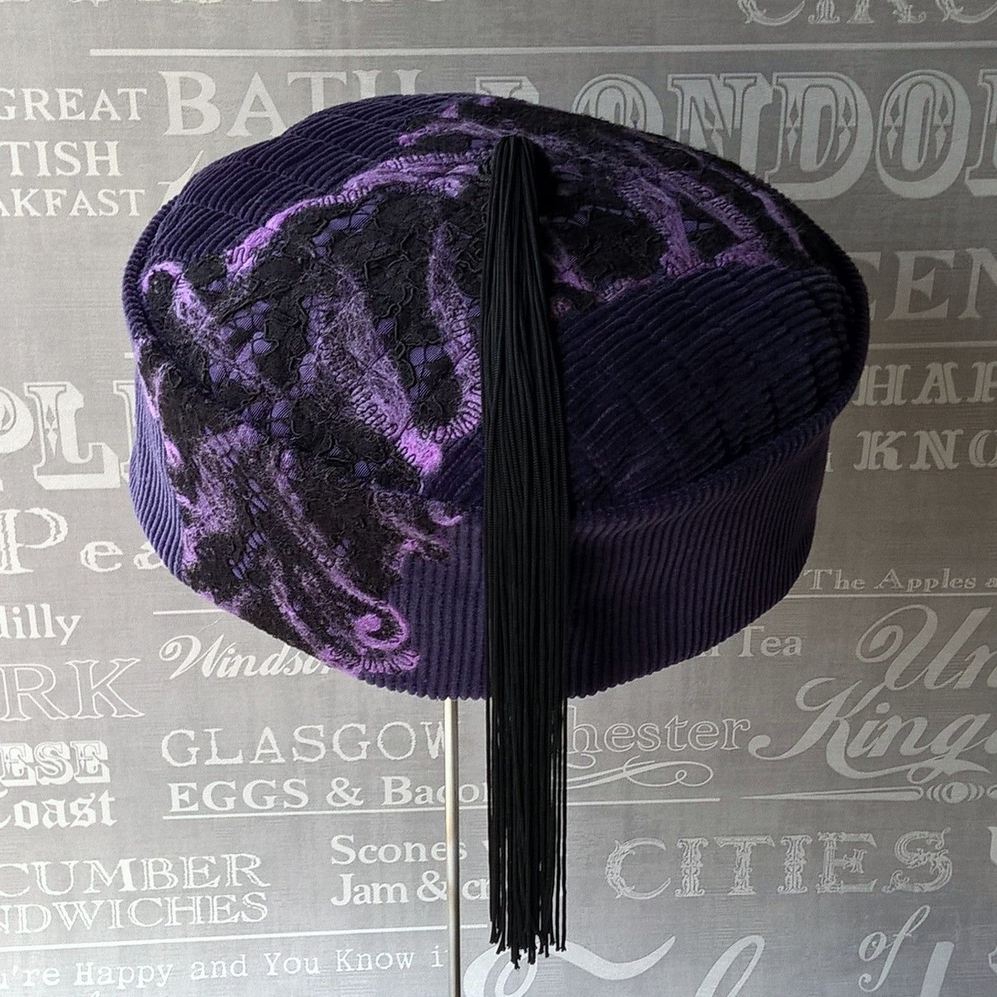 Purple smoking cap with nuno felting and long black tassel