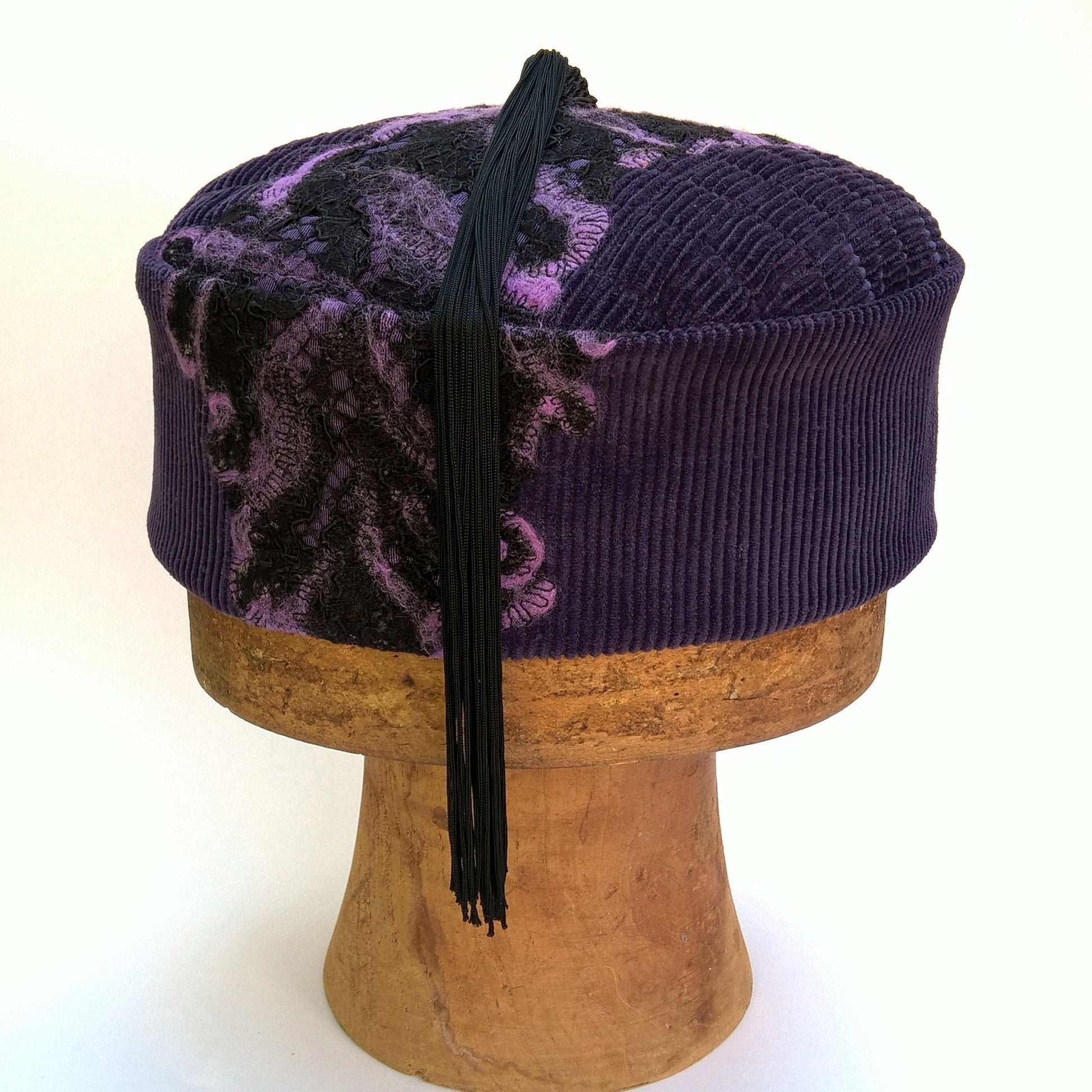 Purple corduroy smoking cap with lace and felted detail and long black tassel